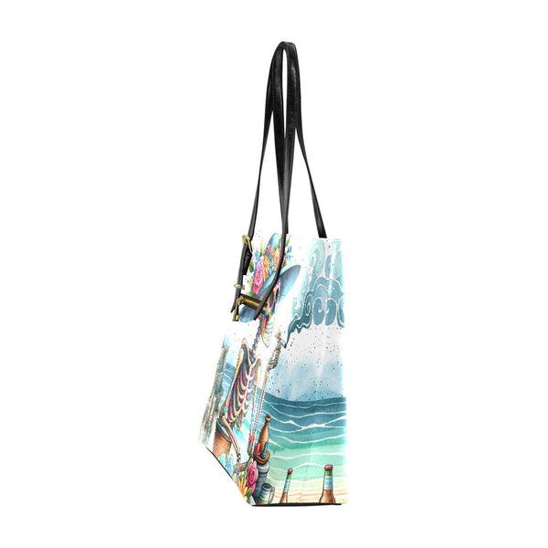 Tote Bag Features A Striking Skull Design Against A Stunning Beach Backdrop