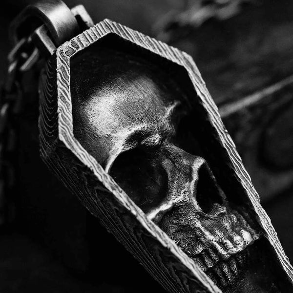 Carved wooden skull pendant on a dark background